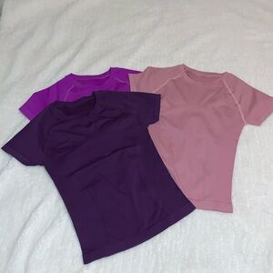 Three very stretchy short sleeved athletic shirts